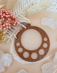 Wooden pendant necklace in a tear drop shape. Made from Queensland walnut. 