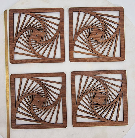 Square wooden coasters with a swirl laser cut out. Zentangle design.