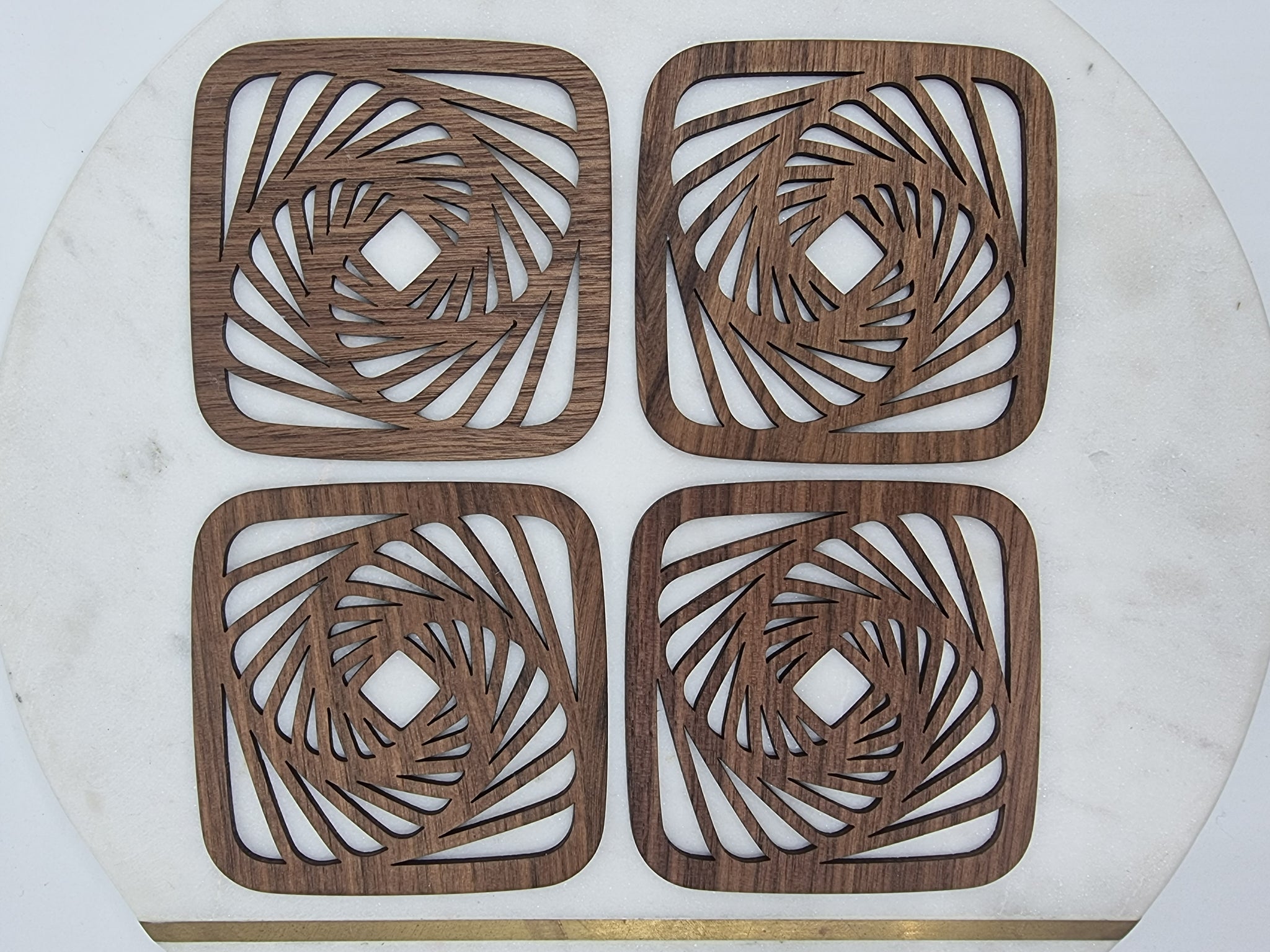 4 wooden swirl design coasters. Made from queensland walnut. 