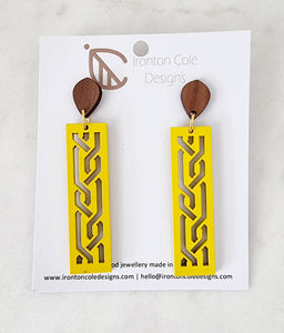 yellow wooden bar earrings with s laser cut designs