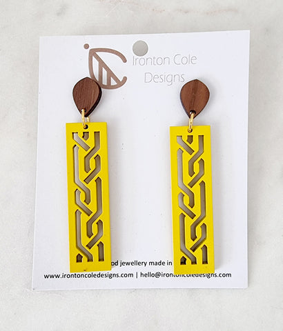 yellow wooden bar earrings with s laser cut designs