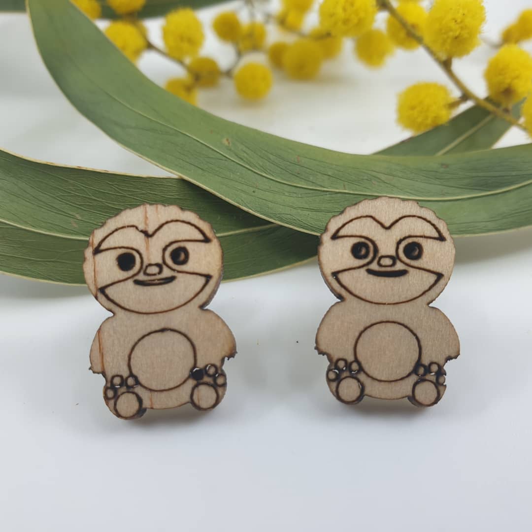 Wooden sloth stud earrings. Hypoallergenic posts which is fine for sensitive ears.