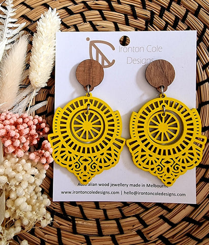 Yellow boho style earrings. Middle circle piece hangs freely in the middle. Hypoallergenic posts. 